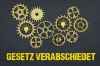 Foto: Zahnräder über Schriftzug GESETZ VERABSCHIEDET